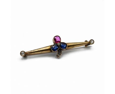 A Russian sapphire, ruby, and diamond bar brooch, the stone set clover motif with old cut diamond terminals to the bar, stamp