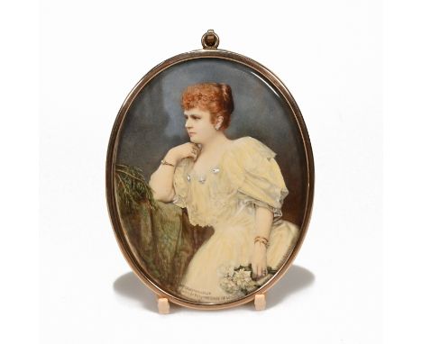 An early 20th century portrait miniature of a female, clutching a bouquet white flowers. In 9ct gold frame and back, inscribe