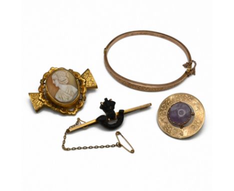 A 9 carat gold hinged bangle; a 9 carat gold brooch; a sweetheart brooch stamped &lsquo;9ct&rsquo;; 13.6 grams gross; and a g