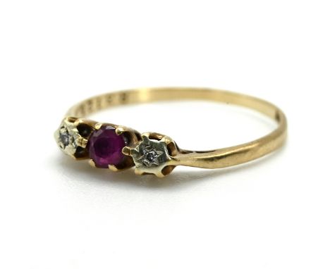 A 9 carat gold ruby and illusion set diamond three stone ring, 1.4 grams gross.&nbsp;