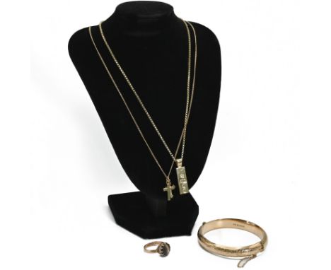 A 9 carat gold hinged bangle, inscribed; a 9 carat gold ingot pendant on a box link chain; a 9carat gold cross pendant on a c