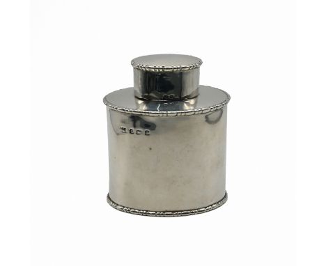 A silver tea caddy, makers mark worn, Birmingham 1911, of plain oval outline with egg and dart borders, with pull off cover, 