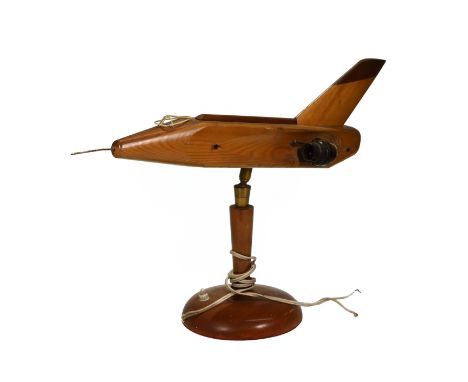 A novelty 1950's wooden lamp in the form of a Jet Aeroplane. A shaped shade on either side wouldmost likely have formed the w