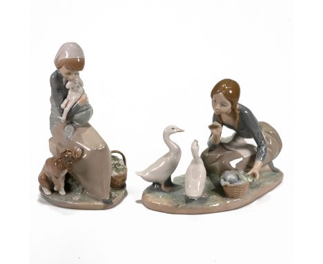 Two Lladro figurines - the first model 1278,  of a girl holding a lamb, watched by a dog - "Devotion/Jealousy", circa 1975-19
