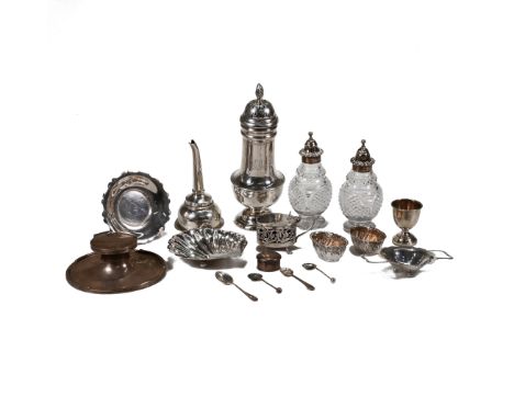 A large silver sugar caster, monogrammed; a pair of silver mounted glass Georgian cruet bottles; a silver shell butter dish; 