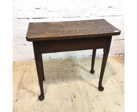 A George III gate leg tea table the fold over top with moulded corners on turned supports terminating in pad feet (when close