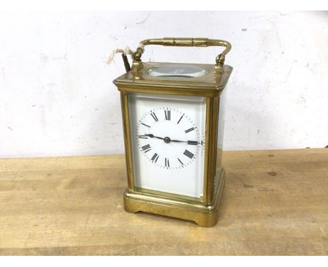 A late 19th early 20thc four glass carriage clock with roman chaptering, (18cm h including handle)