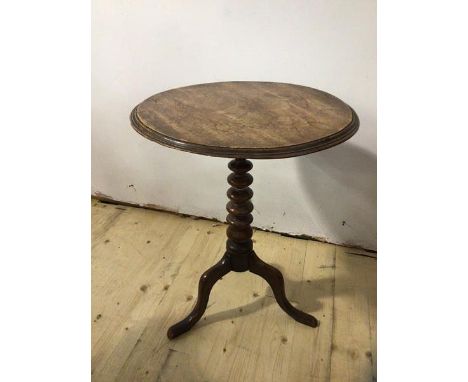 A George III mahogany tilt-top occasional table the circular top with moulded edge on bobbin turned base with tripod supports