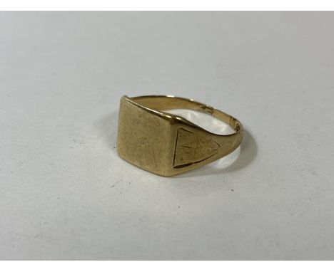 A 9ct gold signet style ring with engraving to shoulders, size V, weighs 2.44 grammes