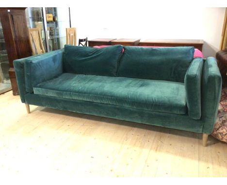 A contemporary four seater Sofa Workshop teal upholstered sofa of square frame with back side and single seat cushion on turn