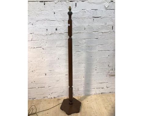 A 1930's / 40's mahogany standard lamp with faceted stem on hexagonal base, (162cm to top of lampholder)