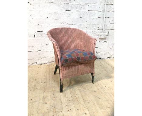 A vintage Lloyd Loom style chair with pink painted back and arms, drop in cushion (68cm x 55cm x 63cm)