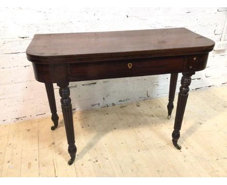 A William IV mahogany fold over d end side table the fold over top cross banded and with ebony inlay with single frieze drawe