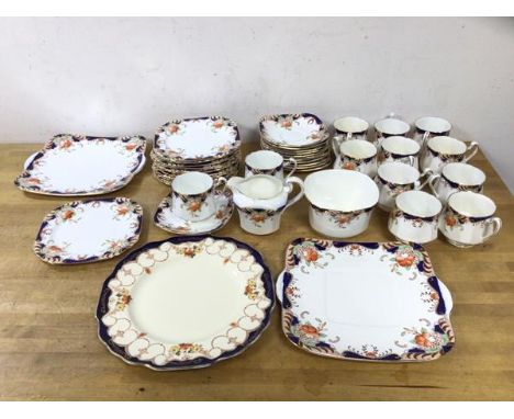 A Heathcote china teaset including twelve teacups, (7cm h), twelve saucers, twelve side plates, milk jug a/f, sugar bowl, two