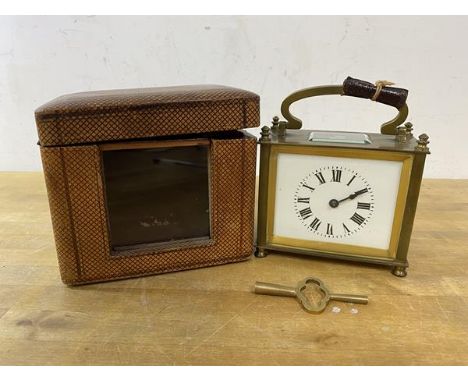 An early late 19th early 20thc carriage clock of squat form, with glass to top and front, roman numerals, movement marked Fra