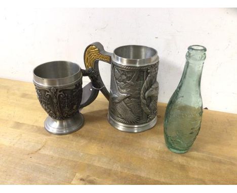 A mixed lot including a vintage soda bottle inscribed Idris and by Royal Warrant, (19cm h) and two pewter mugs, one inscribed