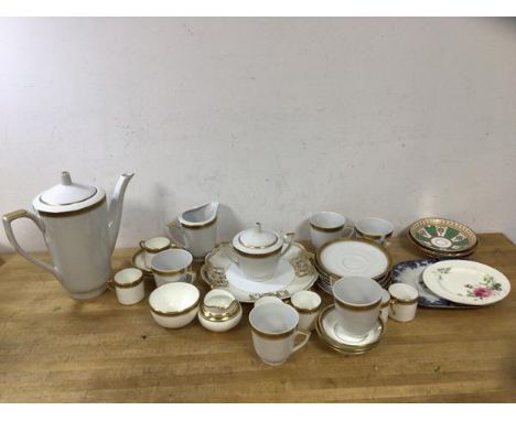 A mixed lot of china including a Polish coffee pot (25cm h), a sugar bowl, milk jug, coffee cups, saucers etc, demitasse cups