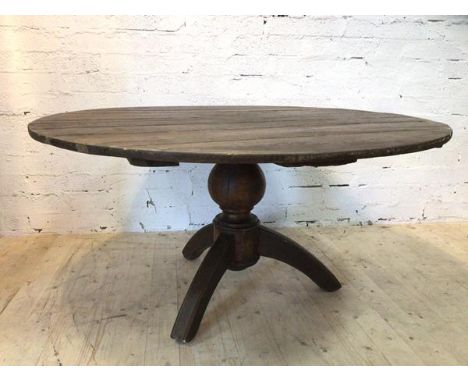 A circular French kitchen table on baluster shaped pedestal with arched tripod supports, (73cm h x 149cm d)