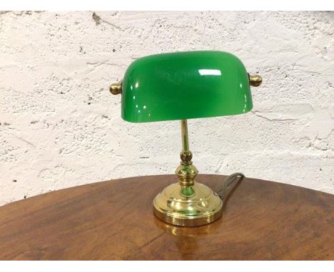 A bankers lamp the green glass shade on brass support (22cm h)