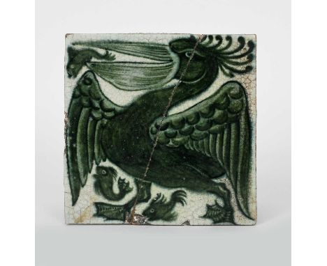 A William De Morgan Merton Abbey stoneware Pelican tile, painted with a large pelican with a fish in its beak, in green on a 