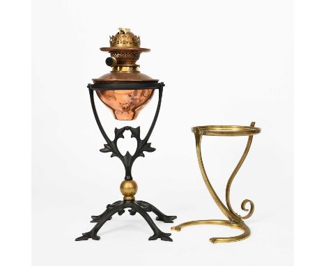 A WAS Benson wrought iron and brass oil lamp, model no,394, arched cruciform foot with trefoil foliate terminals, supporting 