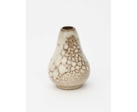 A Ruskin Pottery high-fired stoneware miniature vase designed by William Howson-Taylor, ovoid with tapering neck, covered in 