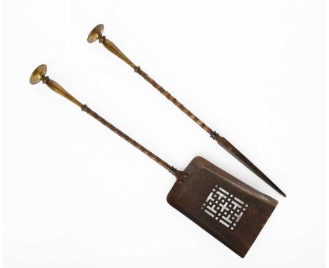 A Bromsgrove Guild bronze and wrought iron fire poker and shovel, each with disc terminal cast with a phoenix panel, unsigned