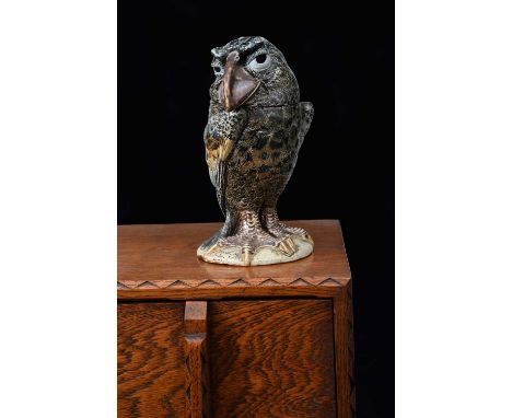 A Martin Brothers stoneware bird jar and cover by Robert Wallace Martin, dated 1897, modelled with broad beak, staring forwar