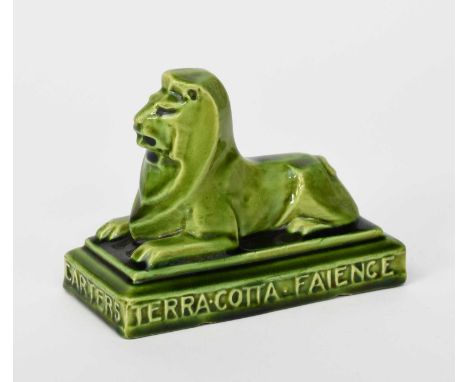 Carters Terracotta Tiles a rare Carter's Poole Pottery advertising paperweight, modelled as a lion, resting on rectangular pl