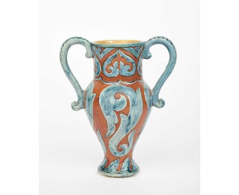 A Della Robbia Pottery vase by John Fogo, shouldered form with applied twin scroll handles, incised with scrolling foliage in