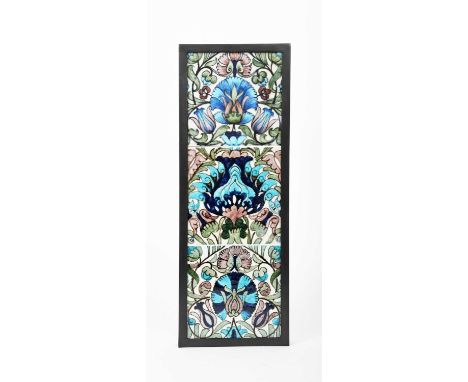 A William De Morgan Persian three tile panel, painted with flowers and foliage in blue, turquoise, aubergine and green, frame