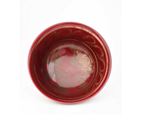 A Bernard Moore flambe footed bowl, painted to the well with a heraldic lion, in red flambe, signed Bernard Moore, 23cm. diam