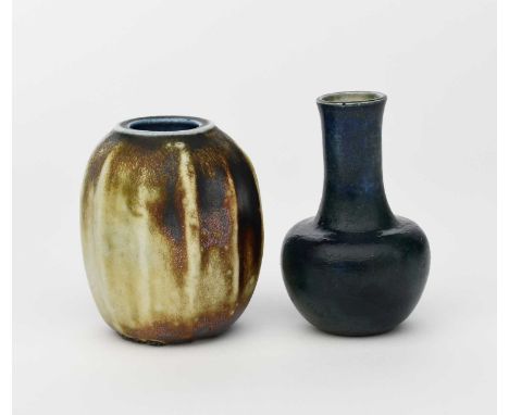 A Martin Brothers stoneware gourd vase by Edwin and Walter Martin, shouldered, ribbed form, covered in a metallic bronze glaz