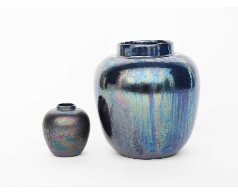 A Ruskin Pottery Kingfisher lustre ginger jar, covered in a petrol lustre glaze and another smaller, a lustre candlestick, a 