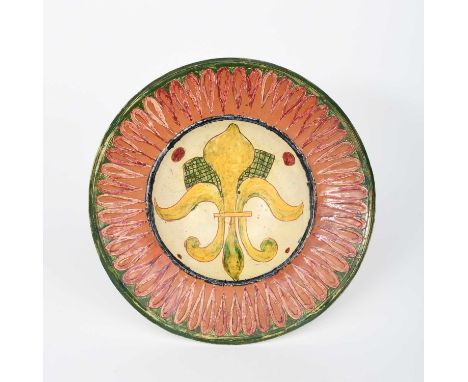 A Della Robbia Pottery plate by Harry Pearce and probably Edward Turri, dated 1895, incised and painted to the well with fleu