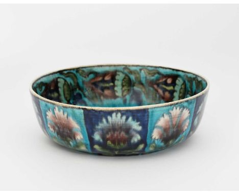 A William De Morgan Persian bowl by Charles Passenger, circular, painted with panels of stylised flowers in blue, turquoise, 