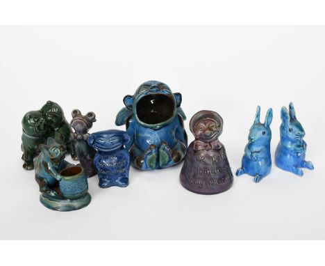 A C H Brannam Barum grotesque spoon-warmer modelled as a cherub with open mouth, dated 1909, glazed blue, with green and brow