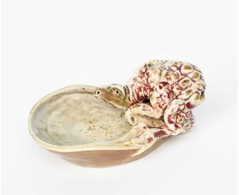 A Martin Brothers stoneware grotesque Dragon dish by Edwin and Walter Martin, dated 1900, modelled in relief with a dragon cr