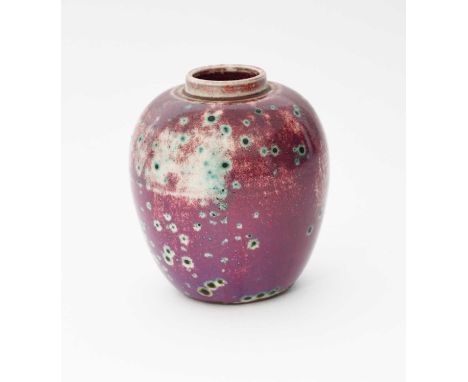 A small Ruskin Pottery high-fired stoneware ginger jar, dated 1933, covered in a purple glaze over silver-grey with turquoise