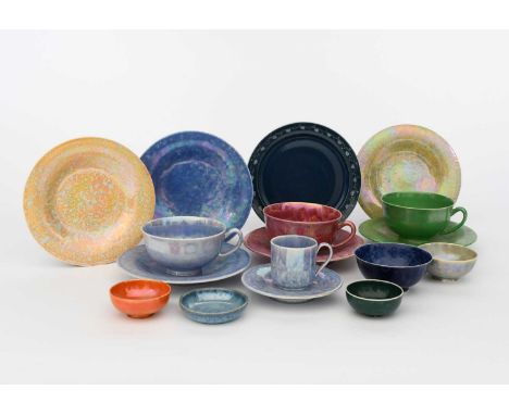 A Ruskin Pottery plate, covered in a blue glaze, the rim with a frieze of foliage, six Ruskin Pottery lustre plates, five min