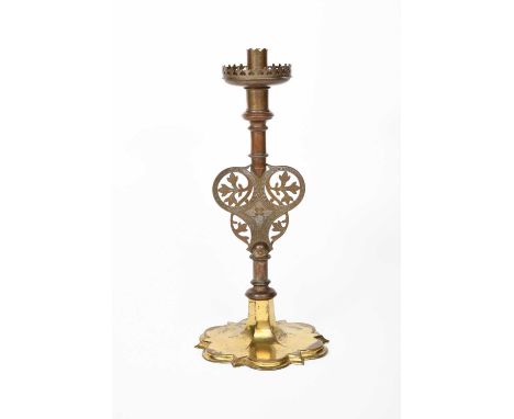 A John Hardman & Co patinated and gilded brass candlestick designed by Augustus Welby Northmore Pugin, lobed gilt base taperi
