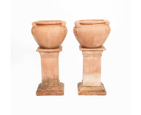 A pair of Compton Pottery terracotta Scroll jardinieres designed by Mary Seton Watts, cast design, on square section bases, i