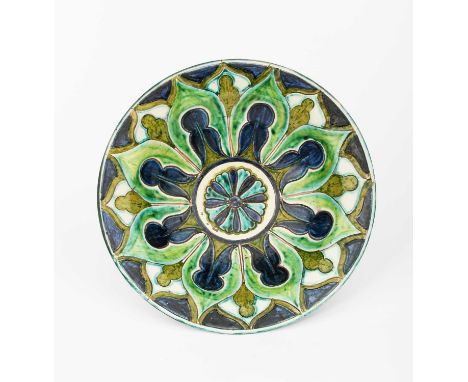 A Della Robbia Pottery bowl by Gertrude Russell, incised and painted with radiating flower design, and central flowerhead rou