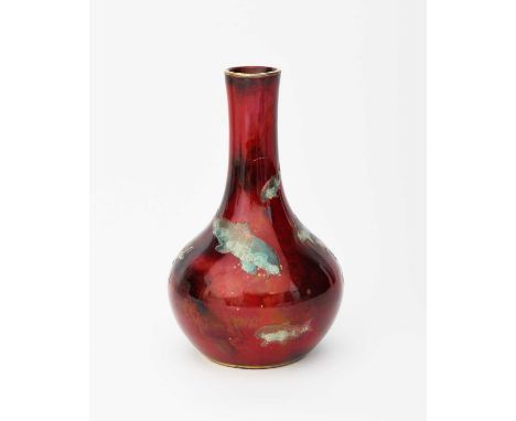 A Bernard Moore flambe solifleur vase, ovoid with cylindrical neck, enamelled with a shoal of fish in turquoise and gilt on a