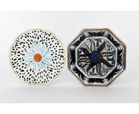A Wedgwood Pottery octagonal plate by Alfred Powell, pattern no.2239, painted with a radiating flower head in black, blue and