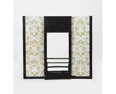 A Barnard Bishop and Barnard cast iron fireplace designed by Thomas Jeckyll, central panel set with cast rectangular panel of