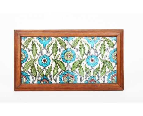 A William De Morgan Merton Abbey Persian two tile panel, painted with stylised flower design in blue, turquoise, green and au