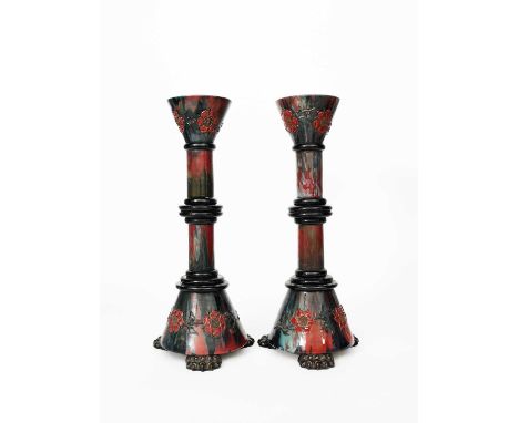 A pair of large Sunflower Pottery candlesticks by Sir Edmund Elton, built in sections, tapering cylindrical base on three cla