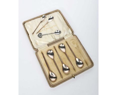 A Keswick School of Industrial Arts part set of silver tea spoons, five spoons with hammered bowls, in fitted case, two small