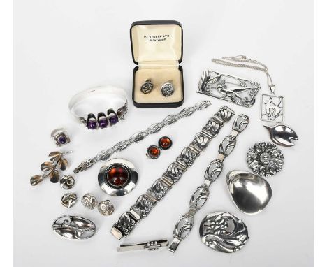 A Georg Jensen silver brooch designed by Georg Jensen, model no.65, pierced, oval form, cast with fruit and foliage design, a